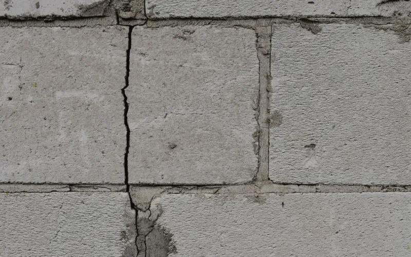This block wall showing cracks is a sign of structural repair needed.